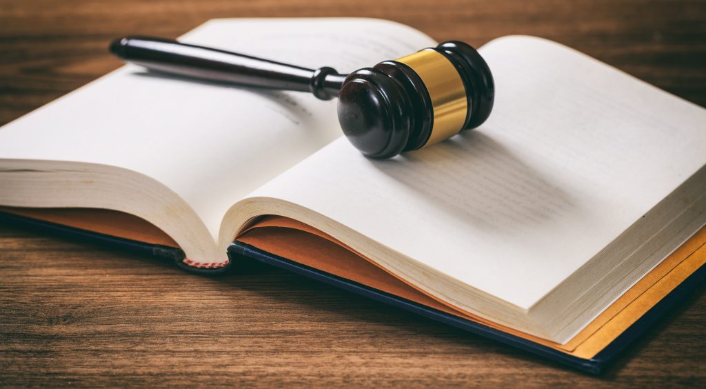 judge or auction gavel on an open book wooden des 2024 12 07 22 54 11 utc scaled